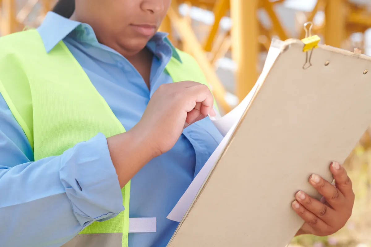 Engineer reviewing checklist and documents for utility connection pre-application