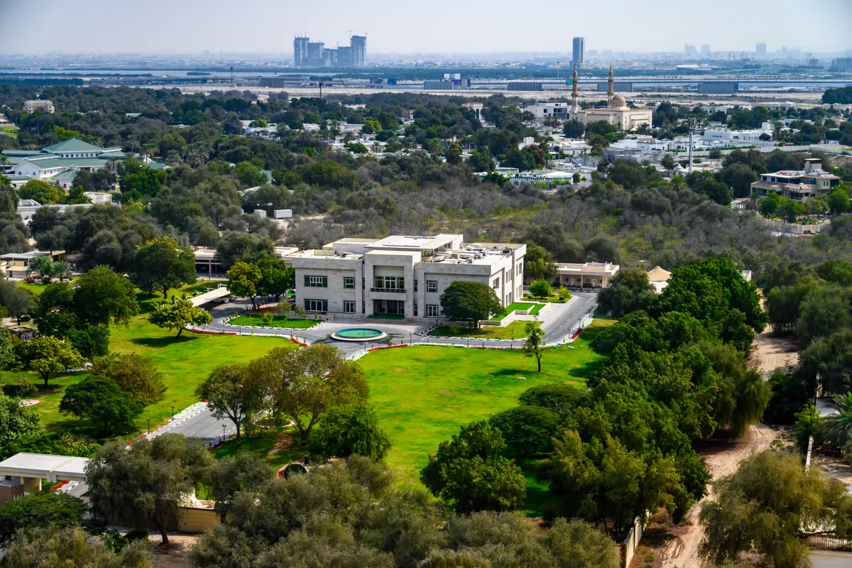 Aerial view of a luxury villa estate and land plot in Dubai