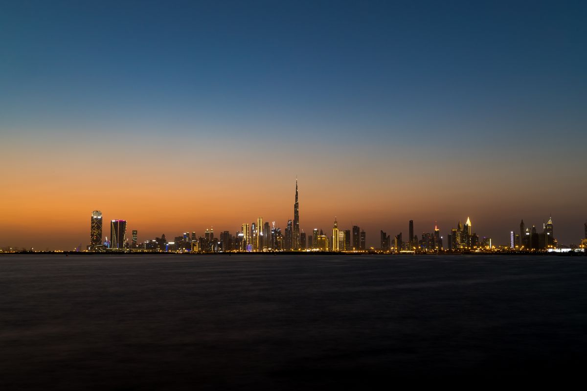 Panoramic view of Dubai skyline at sunset symbolizing urban construction and development projects